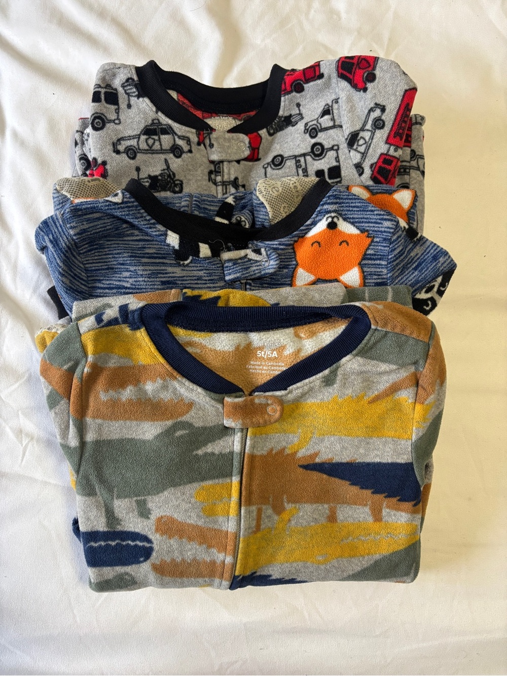 Set of Three 5T Fleece Footed Pajamas.